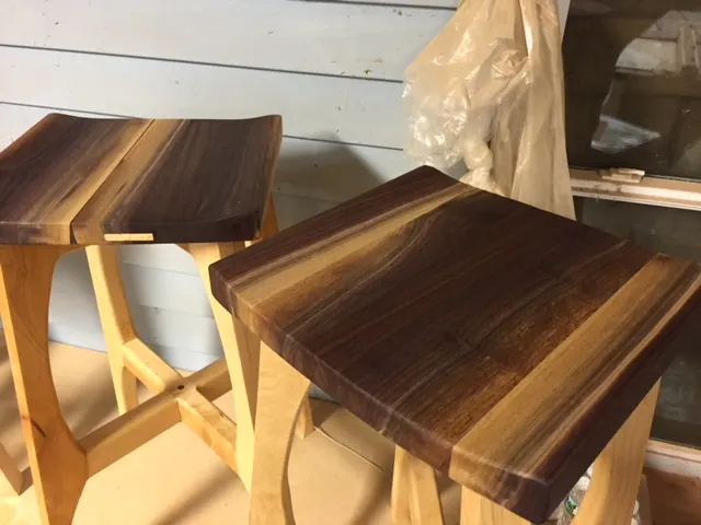 Pictured: walnut and maple stools and tables