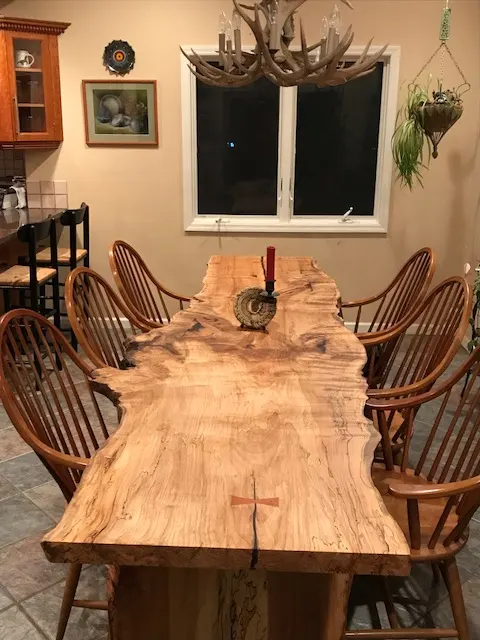Pictured: a live-edge spalted maple dining table, seats ten